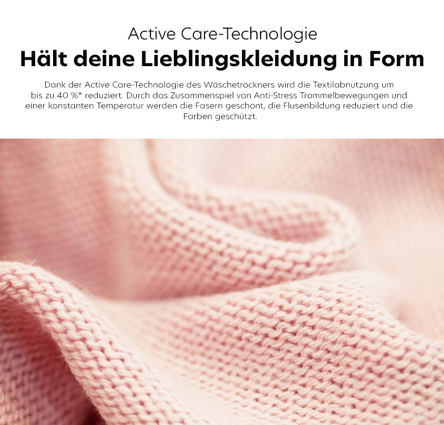 Feature-Banner, Nahaufnahme eines rosa gestrickten Textils mit sichtbarer Maschenstruktur und weicher Faltenbildung.