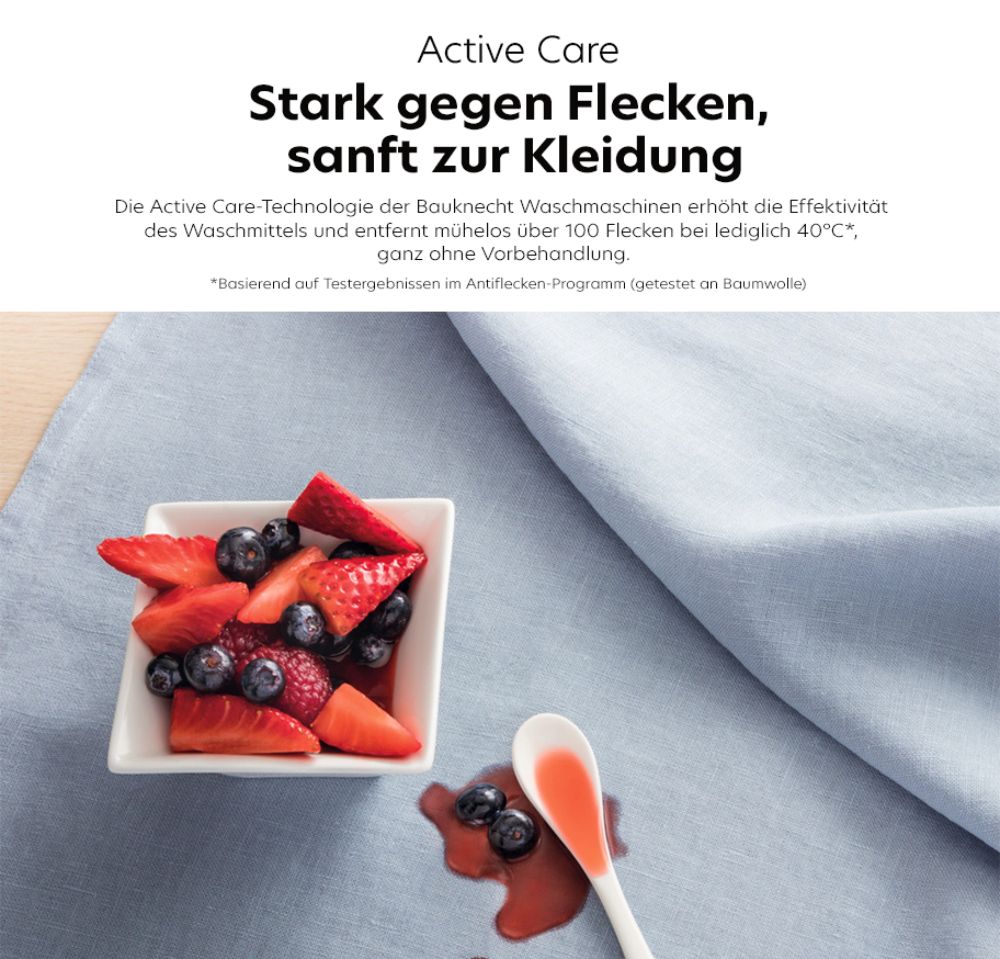 Feature-Banner, Active Care Banner mit einer Schüssel Erdbeeren und Heidelbeeren auf einem blauen Tuch. Text: 'Stark gegen Flecken, sanft zur Kleidung.'