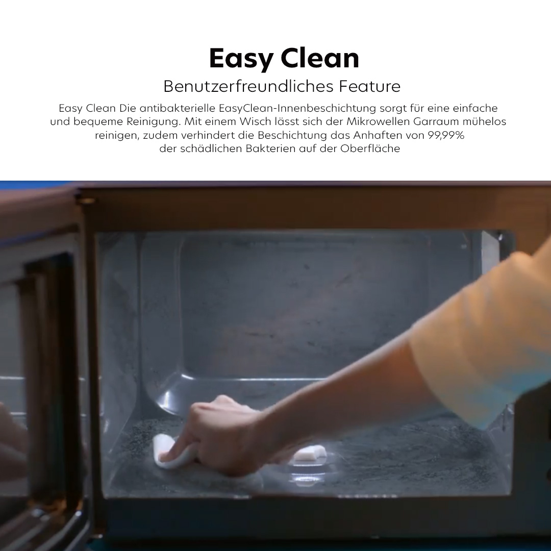 Feature-Banner, Mikrowelle mit 'Easy Clean' Innenbeschichtung. Eine Hand wischt mit einem Tuch über die Innenfläche, um sie zu reinigen. Sichtbare Text: 'Easy Clean Benutzerfreundliches Feature.'
